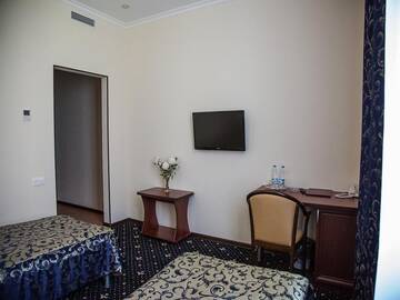 Фото номера Стандартный двухместный номер с 2 отдельными кроватями Гостиница Гранд Отель г. Старый Оскол 3